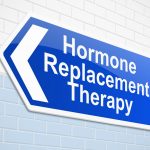 blue hormone replacement therapy sign on tile wall