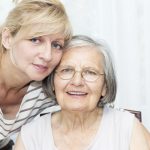 daughter leaning over her mother