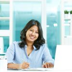 indian women working at desk in office