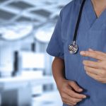 male doctor standing in operating room