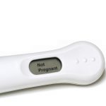 negative pregnancy test on white background