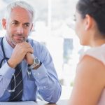 woman talking to doctor