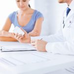 woman talking to her doctor about upcoming surgery
