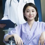 young asian woman leaving hospital