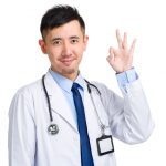 male doctor giving thumbs up signal