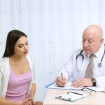 female patient consulting with doctor