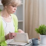 Woman looking at calendar to schedule hysterectomy