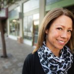 woman downtown wearing black sweater