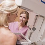 woman undergoing breast screening exam