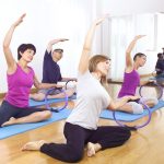 women and man in exercise gym class