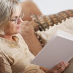 women reading at home on sofa