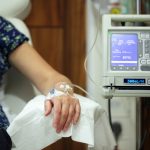 women wearing blue top getting chemotherapy treatments